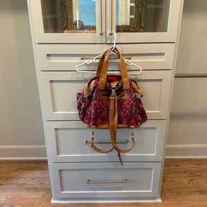 Nena & CO convertible day bag- multicolored purple & pink leather, red interior.